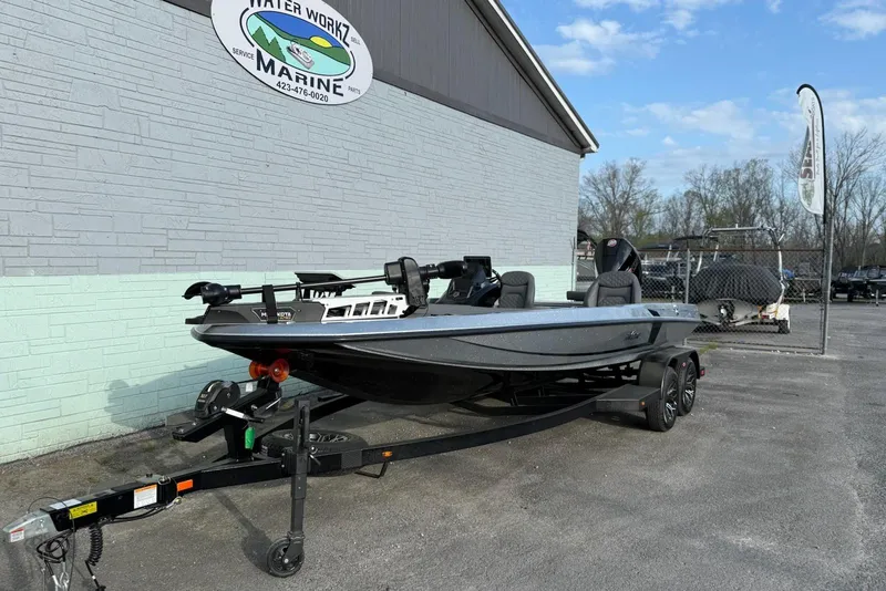 Slide: The Image of 2026 iKon VLX21 boat on trailer outside Water Work Marine dealership. - 2