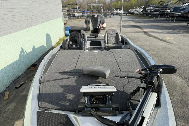 Slide: The Image of 2026 iKon VLX21 fishing boat with advanced Garmin navigation system, parked outdoors. - 8