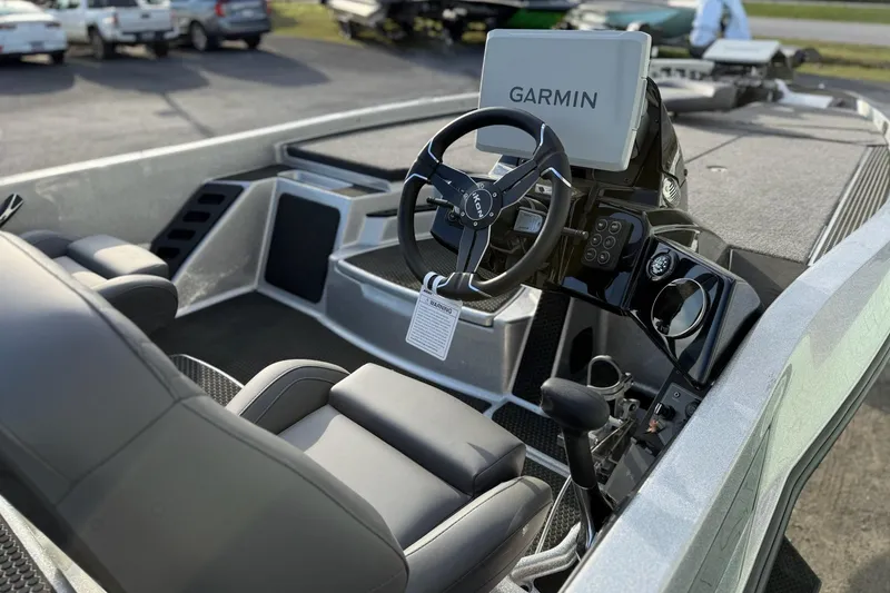 Slide: The Image of 2026 iKon VLX21 boat interior with Garmin navigation system and sleek steering wheel. - 9
