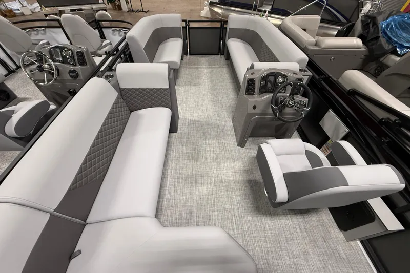 Slide: The Image of 2026 Angler Quest 818 Panfish Cruise interior with modern seating and steering console. - 11