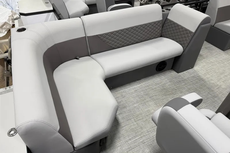 Slide: The Image of 2026 Angler Quest 818 Panfish Cruise boat interior with gray seating and quilted accents. - 12
