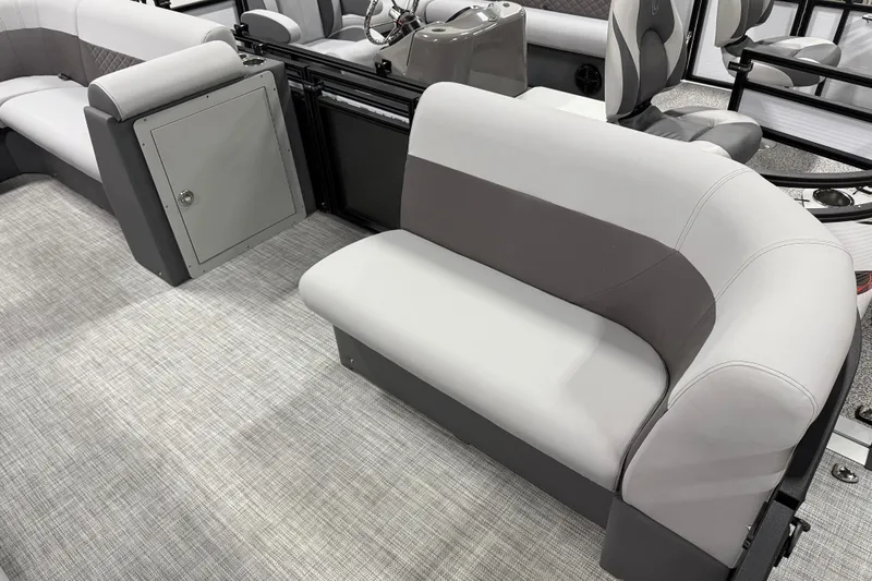 Slide: The Image of 2026 Angler Quest 818 Panfish Cruise interior with gray seating and storage compartment. - 5