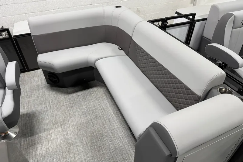 Slide: The Image of 2026 Angler Quest 818 Panfish Cruise boat interior with gray seating and quilted design. - 8