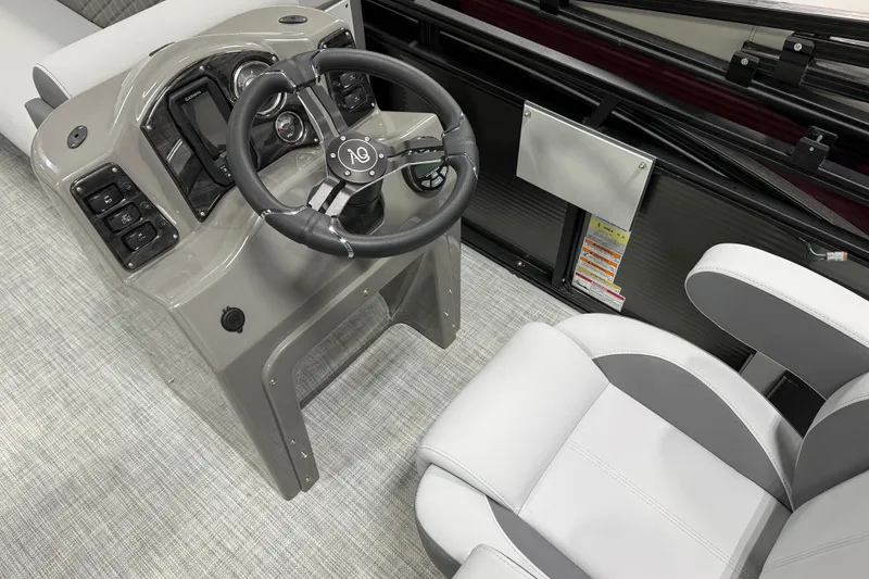 Slide: The Image of 2026 Angler Quest 818 Panfish Cruise boat interior with steering wheel and seating. - 9