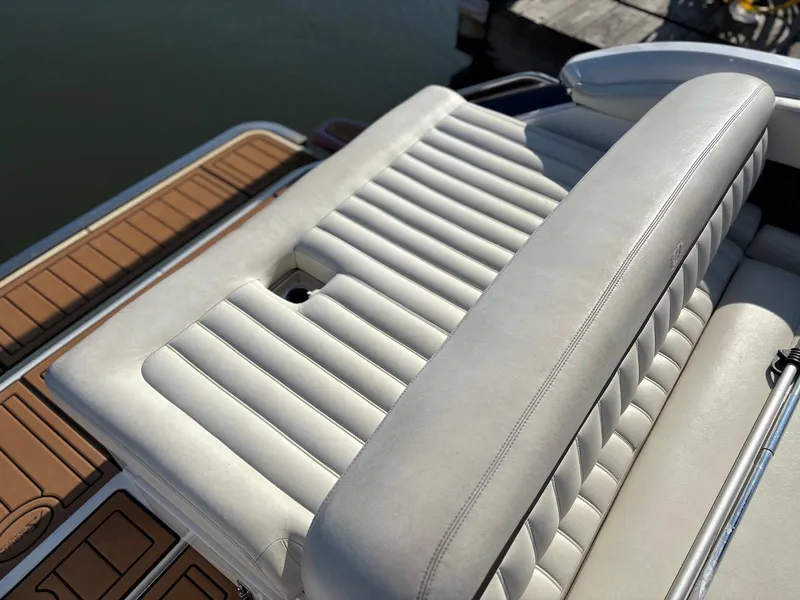 Slide: The Image of Luxury seating on a 2012 Cobalt A28 boat with sleek white upholstery. - 13