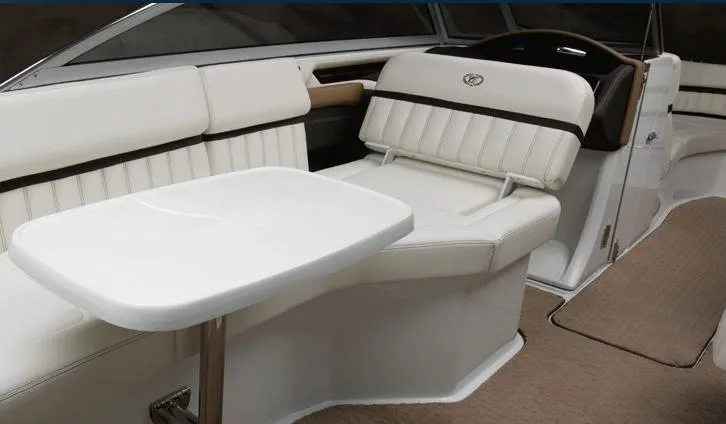 Slide: The Image of Manufacturer Provided Image: 2012 Cobalt A28 boat interior with white seating and table. - 3