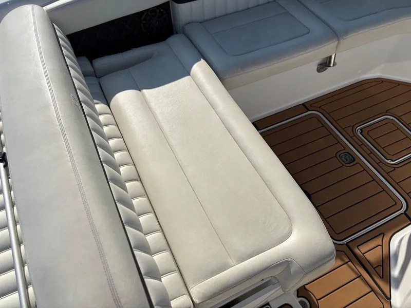 Slide: The Image of Luxurious seating and teak flooring on a 2012 Cobalt A28 boat. - 6