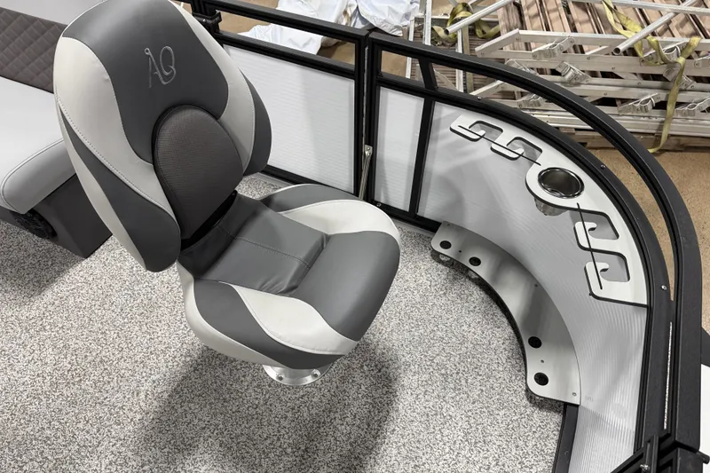 Slide: The Image of 2026 Angler Quest 816 Panfish boat interior with gray seating and rod holders. - 2