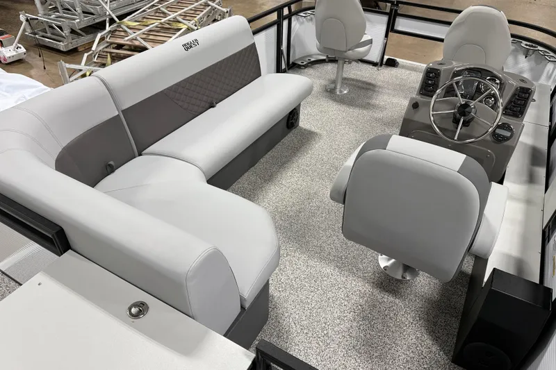Slide: The Image of 2026 Angler Quest 816 Panfish boat interior with seating and steering console. - 8