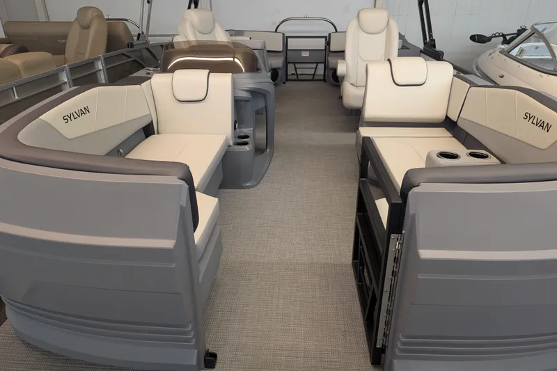 The Image of 2025 Sylvan A-Series 22 LZ DH Sport pontoon boat interior with plush seating. - 0