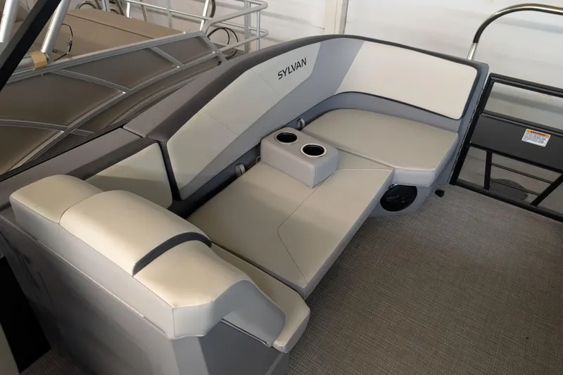 Slide: The Image of 2025 Sylvan A-Series 22 LZ DH Sport boat interior with gray seating and cup holders. - 5