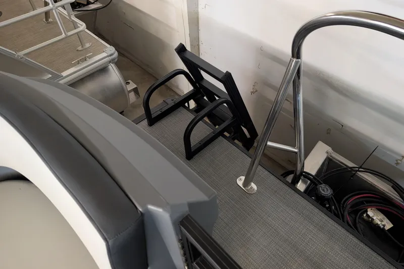 Slide: The Image of 2025 Sylvan A-Series 22 LZ DH Sport boat interior with seating and railing details. - 7