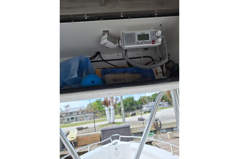 Slide: The Image of Storage compartment on a 2004 Century 2600 Center Console boat with radio equipment. - 5