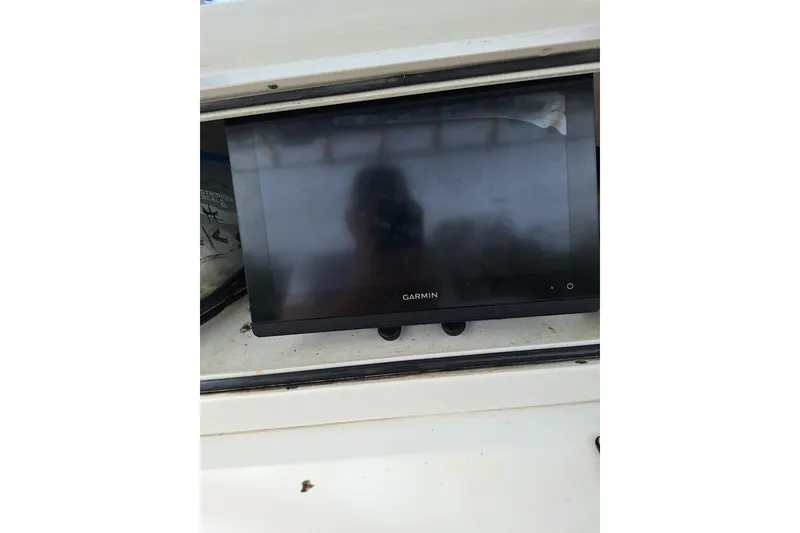 Slide: The Image of Garmin display on 2004 Century 2600 Center Console boat dashboard. - 7