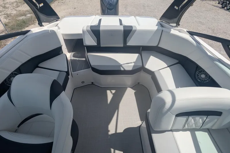 Slide: The Image of 2025 Regal 21 OBX boat interior with spacious seating and modern design. - 11
