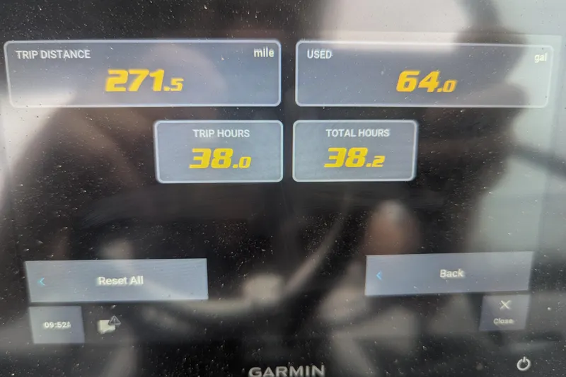 Slide: The Image of Display screen showing trip data: 271.5 miles, 64 gallons used, 38 hours on Regal 21 OBX. - 12