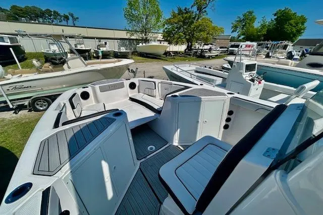 Slide: The Image of 2024 Yamaha Boats 222 FSH Sport E interior, showcasing spacious seating and modern design. - 11