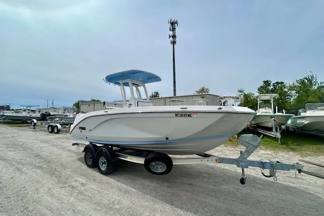 Slide: The Image of 2024 Yamaha Boats 222 FSH Sport E on trailer in outdoor storage area. - 3