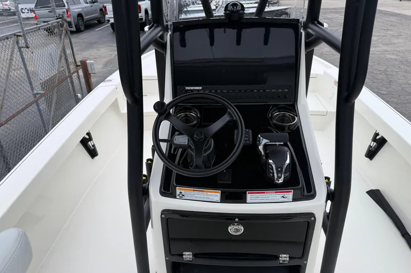 Slide: The Image of 2026 Pathfinder 2500 Hybrid boat console with steering wheel and controls. - 11