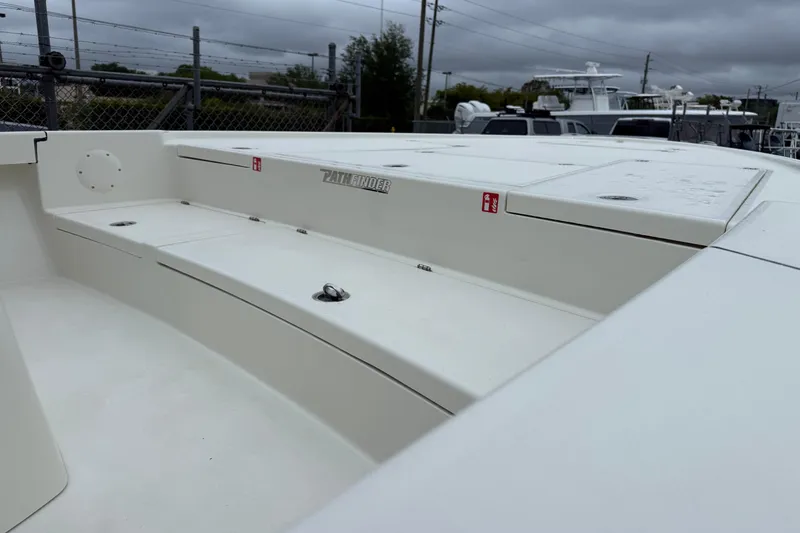 Slide: The Image of 2026 Pathfinder 2500 Hybrid boat deck, featuring sleek design and storage compartments. - 6