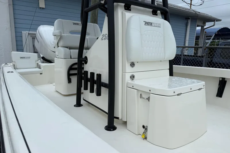 Slide: The Image of 2026 Pathfinder 2500 Hybrid boat interior with white seating and storage compartments. - 7