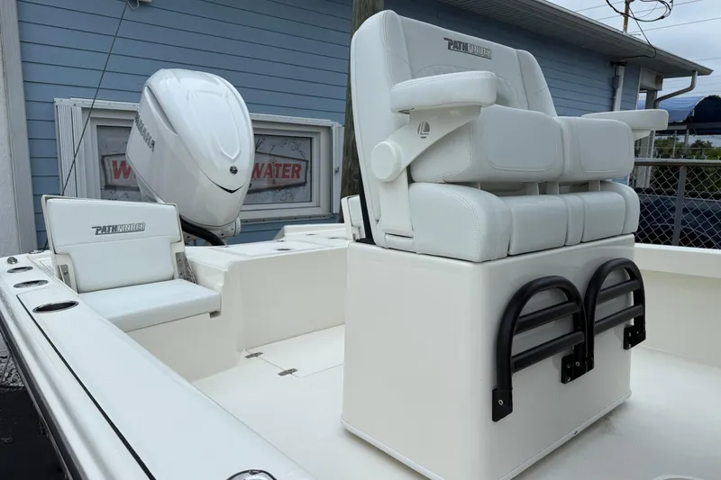 Slide: The Image of 2026 Pathfinder 2500 Hybrid boat interior with white seating and Yamaha engine. - 8