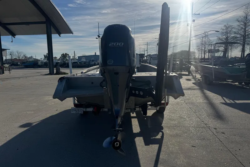 Slide: The Image of Rear view of a 2004 Custom Charles Leonard 21 boat with a 200 HP engine. - 3