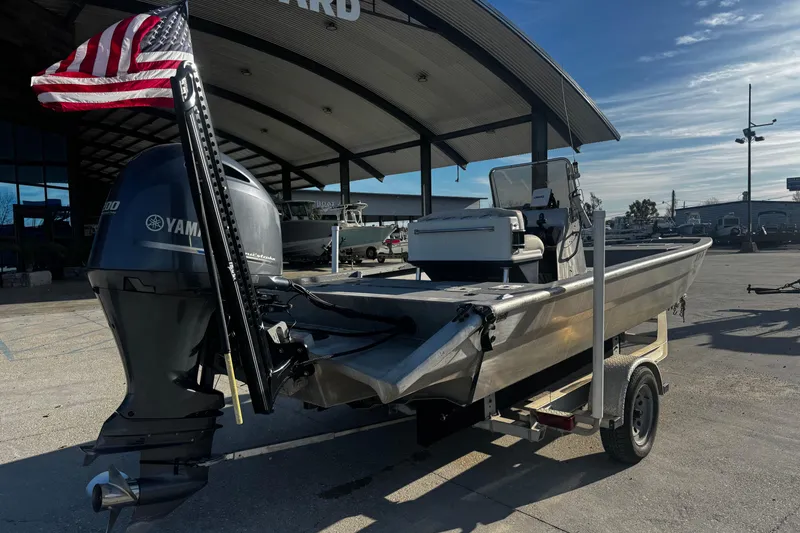Slide: The Image of Custom Charles Leonard 21 boat, 2004 model, with Yamaha engine and American flag, on trailer. - 4