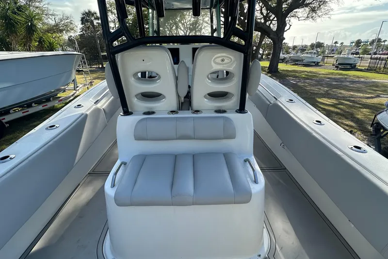 Slide: The Image of 2017 Cape Horn 32 T boat interior with seating and console, parked outdoors. - 10
