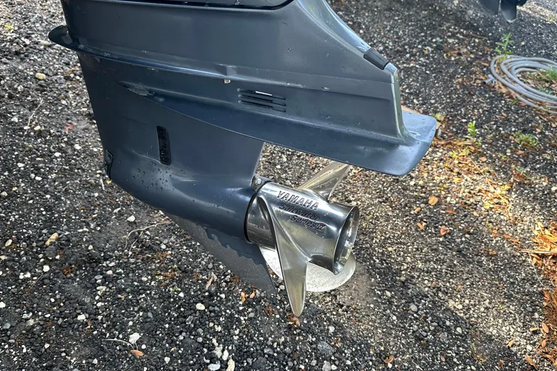 Slide: The Image of Outboard motor propeller of a 2017 Cape Horn 32 T boat on gravel surface. - 15