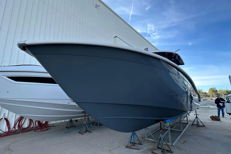 Slide: The Image of 2017 Cape Horn 32 T boat on stands outside a warehouse. - 5