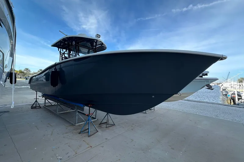Slide: The Image of 2017 Cape Horn 32 T boat on dry dock, marina background, clear sky. - 7