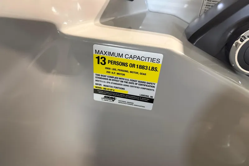 Slide: The Image of Capacity label on 2026 Manitou 23 Aurora SL VPII, seating 13 people or 1883 lbs. - 11
