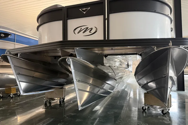Slide: The Image of 2026 Manitou 23 Aurora SL VPII pontoon boat, showcasing sleek aluminum hull design. - 4