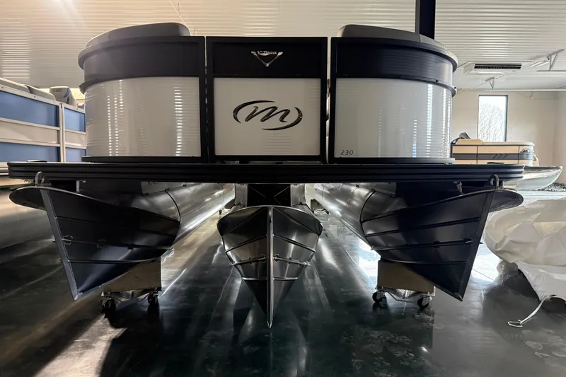 Slide: The Image of 2026 Manitou 23 Aurora SL VPII pontoon boat in showroom, front view. - 5