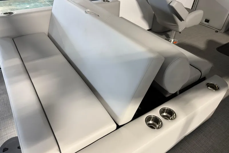 Slide: The Image of Luxurious seating on 2026 Manitou 23 Aurora SL VPII boat with cup holders. - 9