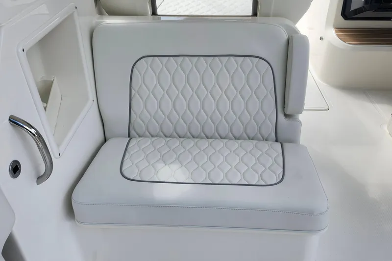 Slide: The Image of Luxurious seating on 2026 Pursuit DC 286 Dual Console boat, featuring elegant white upholstery. - 18
