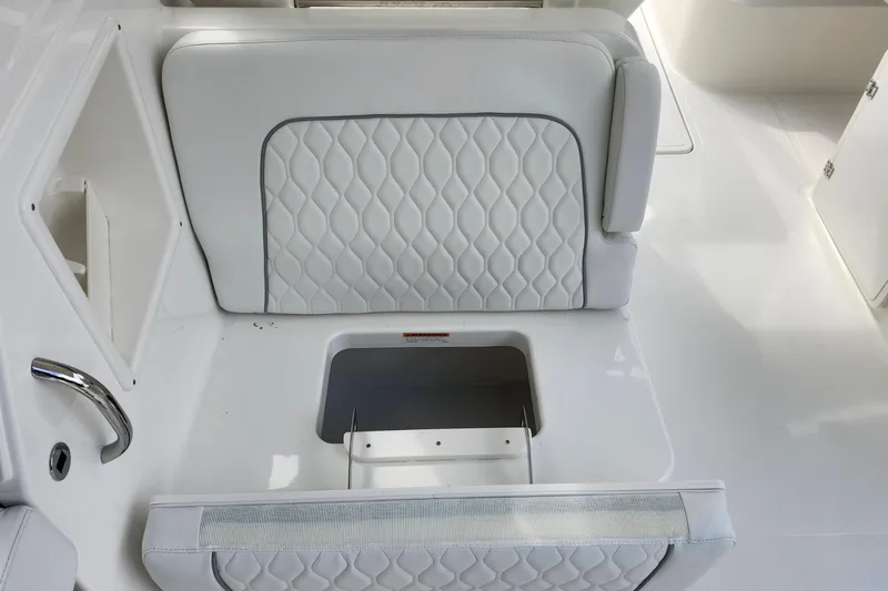 Slide: The Image of 2026 Pursuit DC 286 Dual Console boat seat with storage compartment. - 19
