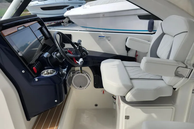 Slide: The Image of 2026 Pursuit DC 286 Dual Console boat interior with modern helm and comfortable seating. - 22