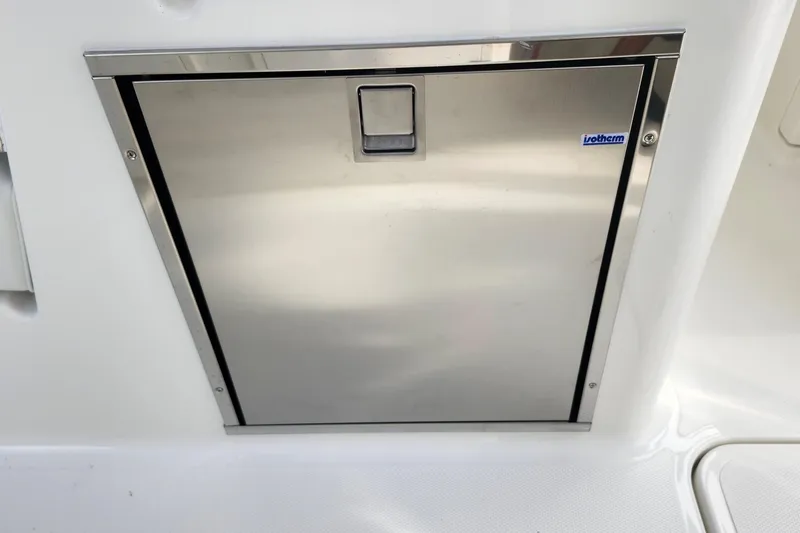 Slide: The Image of Stainless steel compartment door on 2026 Pursuit DC 286 Dual Console boat. - 25