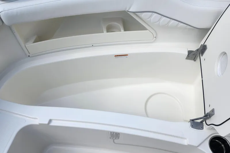Slide: The Image of Interior storage compartment of 2026 Pursuit DC 286 Dual Console boat. - 32