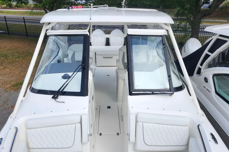 Slide: The Image of 2026 Pursuit DC 286 Dual Console boat, featuring sleek design and spacious seating. - 35