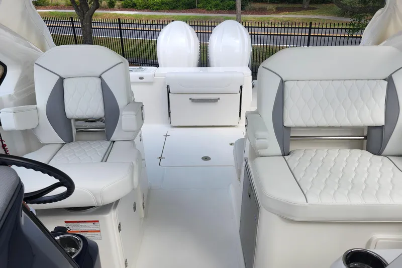 Slide: The Image of 2026 Pursuit DC 286 Dual Console interior with white quilted seating and modern design. - 36