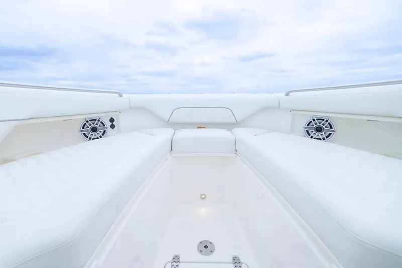 Slide: The Image of Manufacturer Provided Image: 2026 Pursuit DC 286 Dual Console boat interior with white seating and speakers. - 4