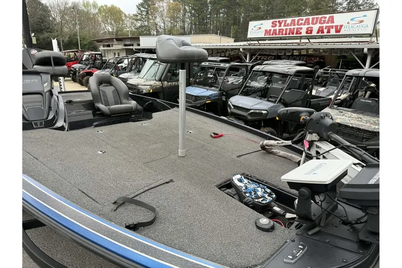 Slide: The Image of 2022 Nitro Z20 boat at Sylacauga Marine & ATV dealership, surrounded by off-road vehicles. - 8