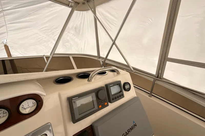 Slide: The Image of 1999 Silverton 422 Motor Yacht helm with Garmin navigation system and gauges. - 15