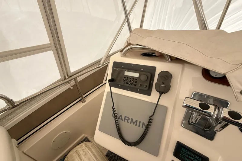 Slide: The Image of 1999 Silverton 422 Motor Yacht helm with Garmin navigation and communication equipment. - 18