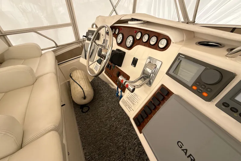 Slide: The Image of Interior helm of 1999 Silverton 422 Motor Yacht with navigation instruments and steering wheel. - 22