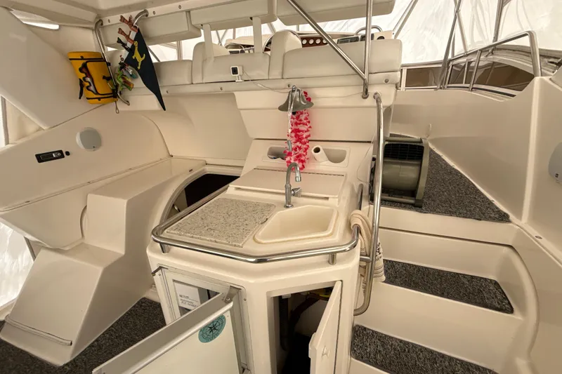 Slide: The Image of 1999 Silverton 422 Motor Yacht interior with sink, stairs, and nautical decor. - 26