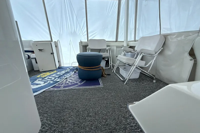 Slide: The Image of Interior of 1999 Silverton 422 Motor Yacht with seating and nautical decor. - 32